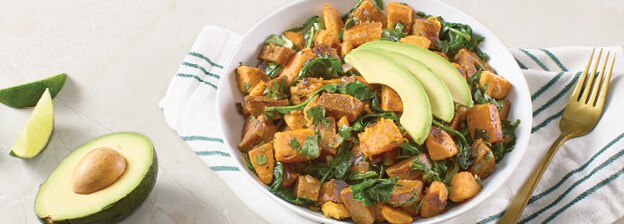 Bowl of Chorizo and Sweet Potato Hash with avocado.