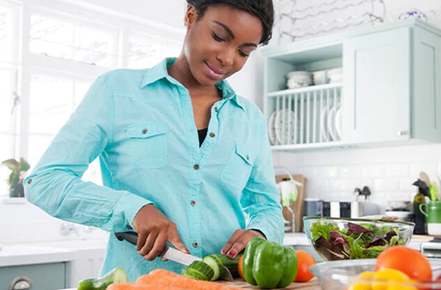 woman cutting up vegetables