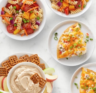 loaded tortillas, pasta salad, hummus with pretzels