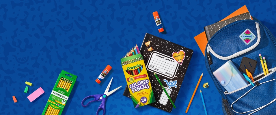 A variety of school supplies on a blue patterned background, including Ticonderoga pencils, Crayola colored pencils, scissors,  glue sticks, erasers, a sticker-covered composition book, and an open backpack with folders and stationery inside