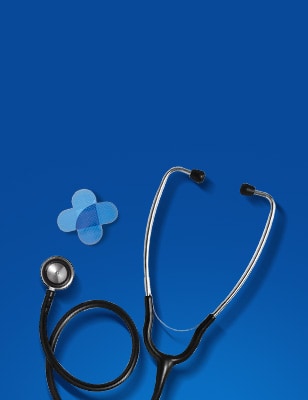 A stethoscope and a cross-shaped adhesive bandage on a blue background. The stethoscope is black with silver  accents, and the bandage is made of two overlapping blue strips.