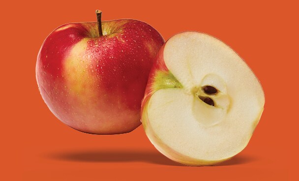 One whole apple and another apple cut in half