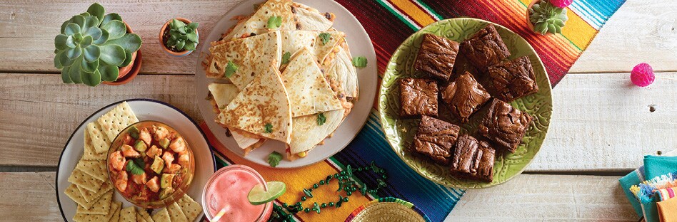 spead of assorted cinco de mayo dishes on table