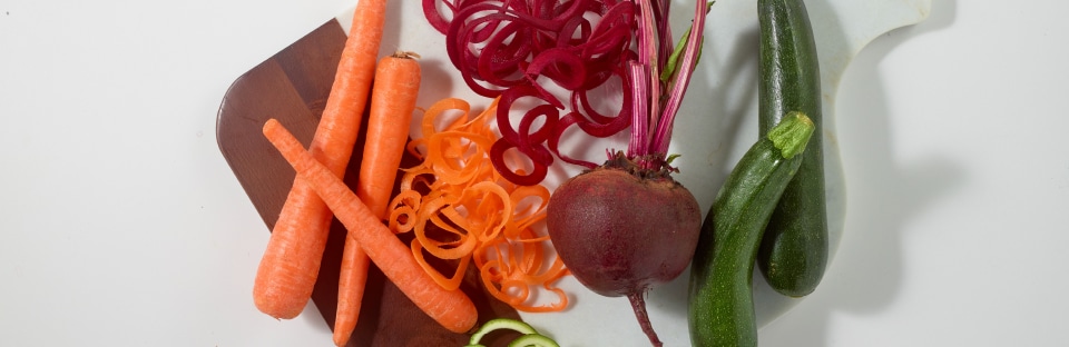 cutting board of spiralized veggies
