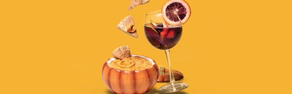 Smoky pumpkin hummus and pita chips with blood orange sangria