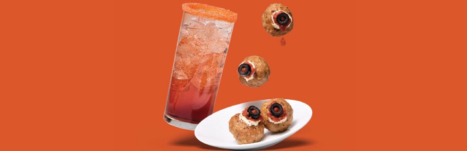 Spooky eye pizza meatballs with treat-or-treat spritz