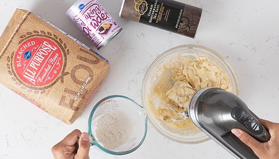 Mixing flour, baking powder, and salt