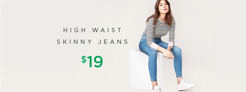 young woman in high waist skinny jeans