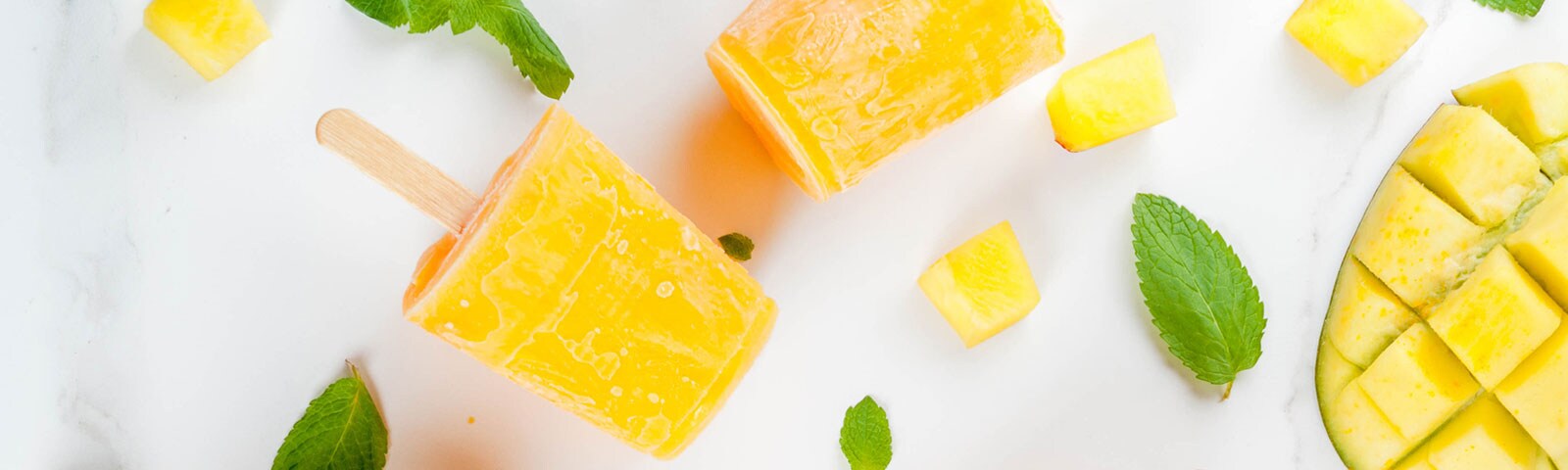 Cut up fruit freezed into popsicles on a stick Cut up fruit freezed into popsicles on a stick