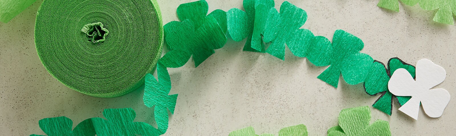 Green paper garland streamers cut into shamrock shapes
