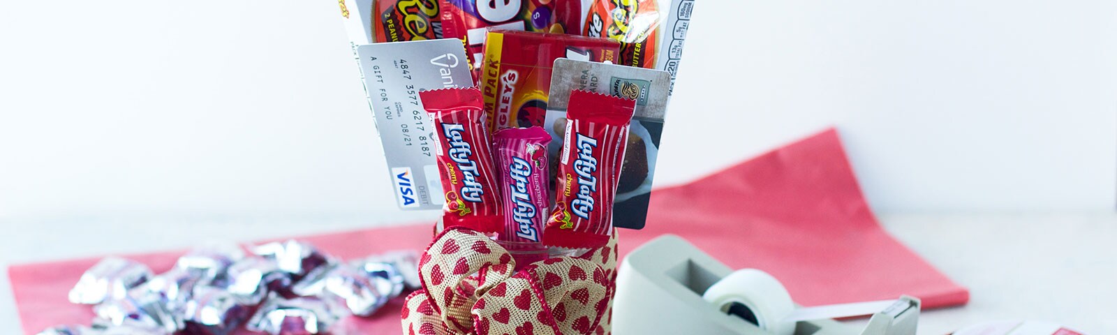 Vase with gift cards and candy as a bouquet