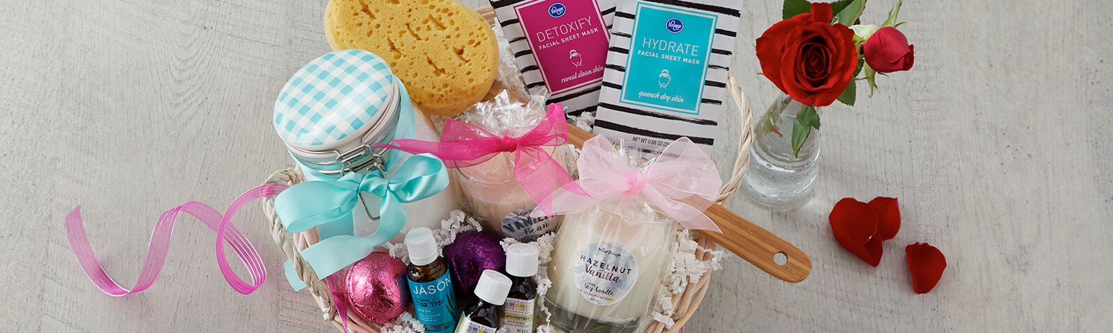 Gift basket filled with valentine's date checklist items such as candles, bath bombs and face masks Gift basket filled with valentine's date checklist items such as candles, bath bombs and face masks
