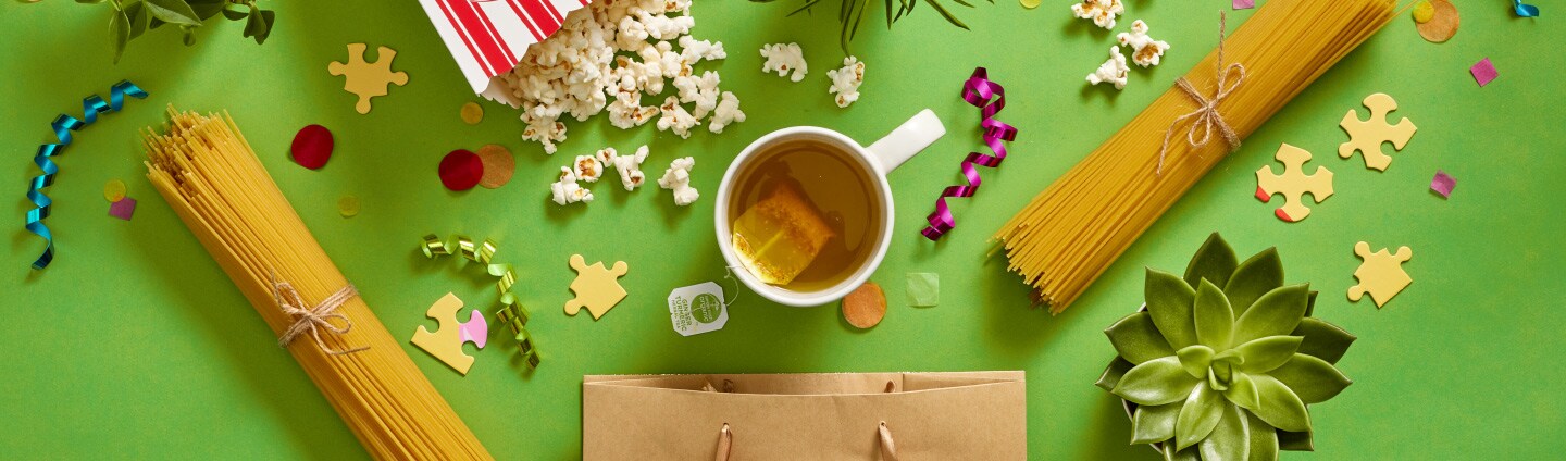 popcorn, spaghetti, hot tea, puzzle pieces and plans all spilled out of gift bag